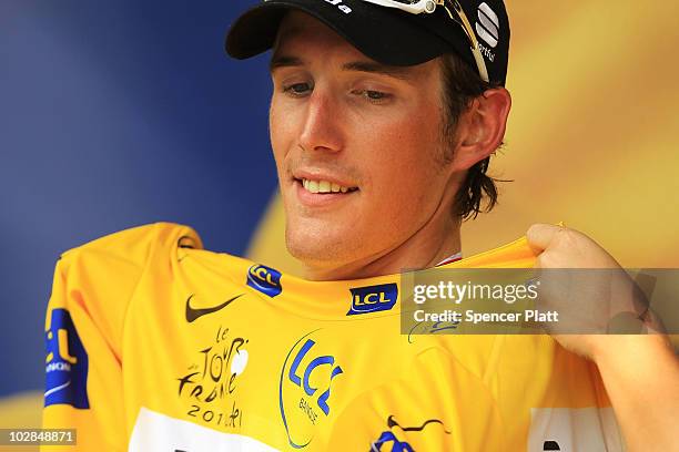 Andy Schleck of team Saxo Bank puts on the yellow jersey following the end of stage nine of the Tour de France on July 13, 2010 in Jean De Maurienne,...