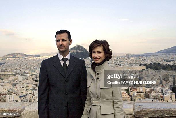 Syrian President Bashar al-Assad and his wife Asma pose for photographers during their visit to Acropolis archaeolgical site in downtown Athens 15...