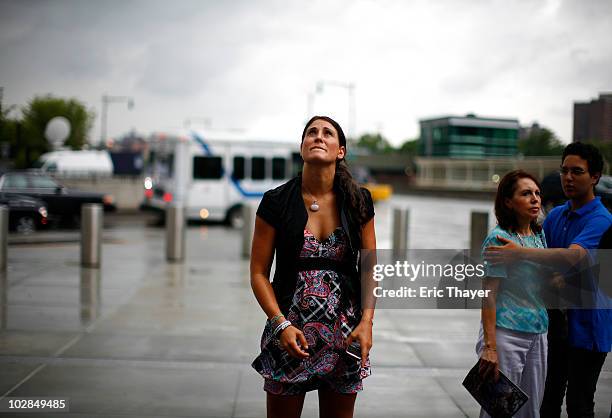 Fan Mary Byrne of Saddlebrook, New Jersey, looks up in front of Gate 4 at Yankee Stadium, after the death of George Steinbrenner July 13, 2010 in the...