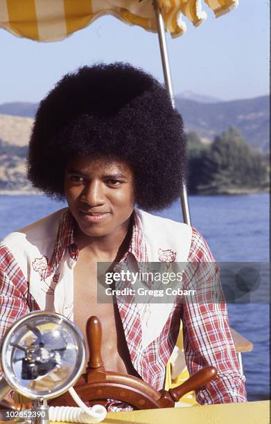 Michael Jackson of The Jacksons poses during a publicity photo shoot after being signed to Epic Records, at brother Jackie Jackson's home on August...