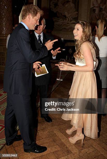 Prince Harry greets singer Hayley Westenra as he attends the Friends of the Forces Awards at the Liberal Club on July 13, 2010 in London, England....