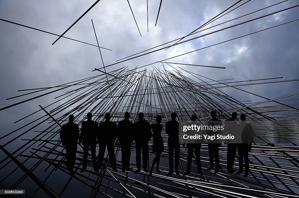 Cloudy sky, 3D line object and a person's silhouet