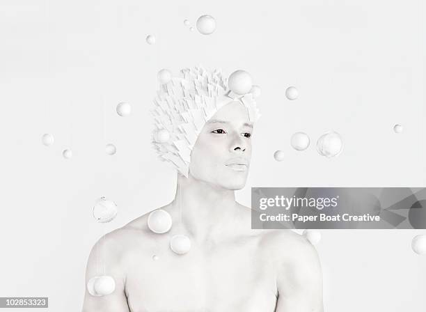 all white image of a man in the center of planets - body paint stock pictures, royalty-free photos & images