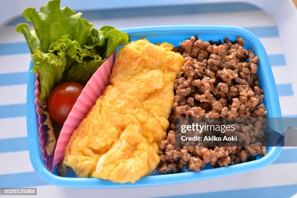 bento box lunch on tray with light blue and white stripes. - silicon stock pictures, royalty-free photos & images