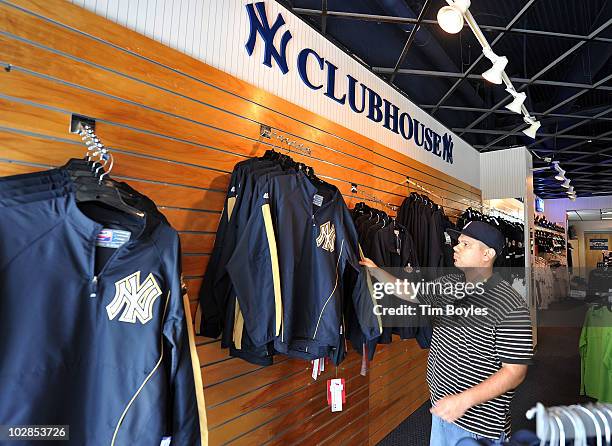 William Arroyo shops for memorabilia in the gift shop of George M. Steinbrenner Field, after the death of George Steinbrenner on July 13, 2010 in...
