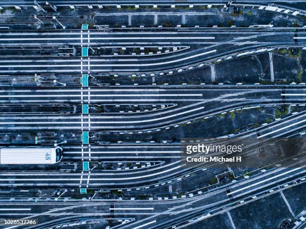 aerial view of railroad tracks - schienenverkehr stock-fotos und bilder