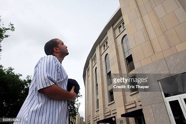 Edwin Matos of the Bronx, looks up at Gate 4, after the death of George Steinbrenner, July 13, 2010 at Yankee Stadium in the Bronx borough of New...