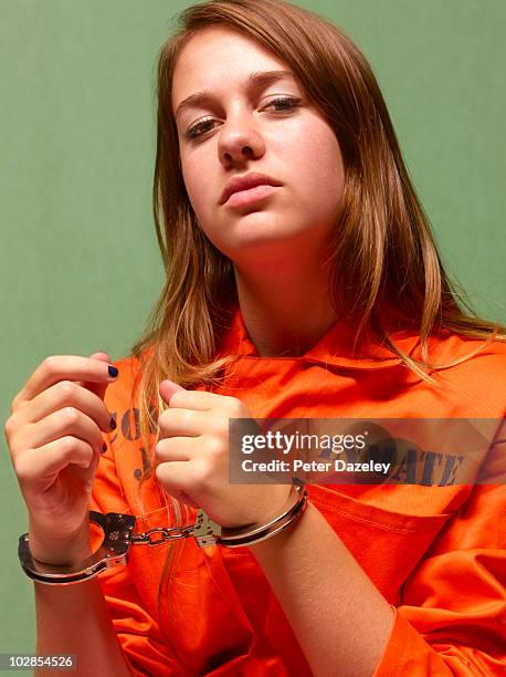 juvenile girl in prison - gevangene stockfoto's en -beelden