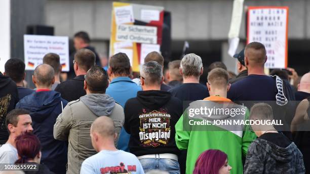 Protester wears a T-shirt reading "East Germany, this is not Disneyland here" during a march organised by the right-wing populist "Pro Chemnitz"...