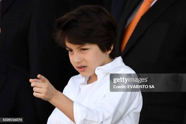 Brazilian President Michel Temer's son, Michel Temer Jr., gestures as he attends the Independence Day parade at the Ministries Esplanade in Brasilia,...