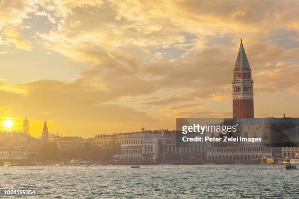 view of venice from the venetian lagoon, italy at sunset - doge's palace stockfoto's en -beelden