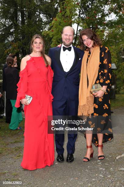 Nastassia Bach, Prince Philipp zu Oettingen-Wallerstein and Carlotta Cramer-Klett during the wedding of Prince Konstantin of Bavaria and Princess...