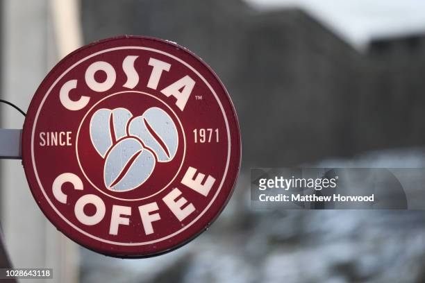 General view of a Costa Coffee shop sign on February 27, 2018 in Cardiff, United Kingdom. Costa Coffee owner Whitbread, which also owns the Premier...