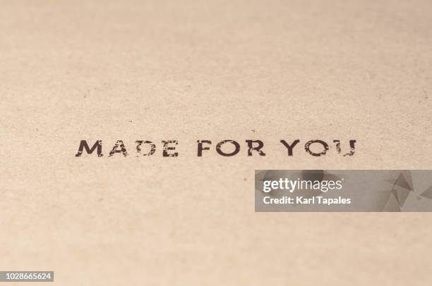 a "made for you" sign written on a brown paper - custom fotografías e imágenes de stock