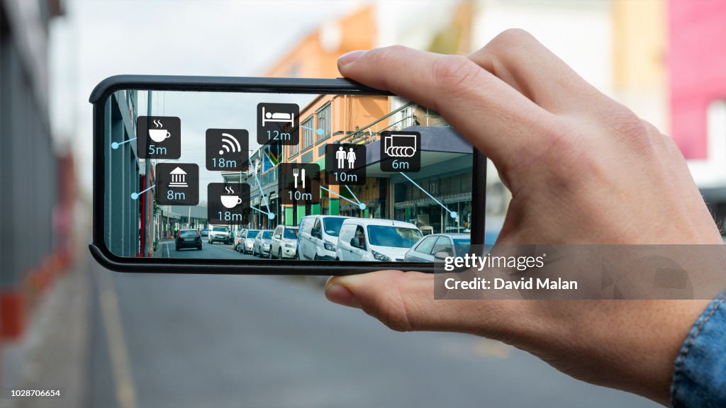 Augmented reality of a city street shown on a mobile device.