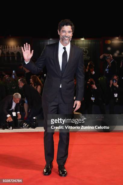Alessandro Gassmann walks the red carpet ahead of the "Una Storia Senza Nome" screening during the 75th Venice Film Festival at Sala Grande on...