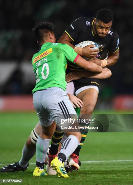 Luther Burrell of Northampton Saints is tackled Marcus Smith of Northampton during the Gallagher Premiership Rugby match between Northampton Saints...