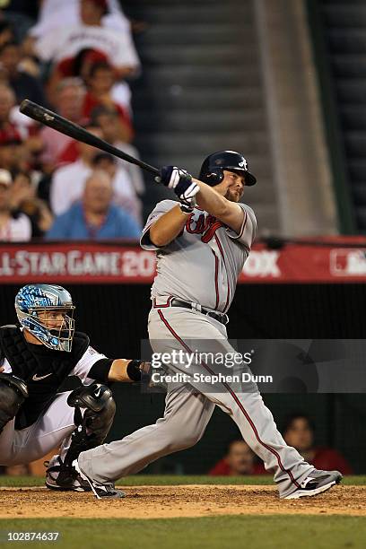 National League All-Star Brian McCann of the Atlanta Braves hits the ball for a three run double during the 81st MLB All-Star Game at Angel Stadium...