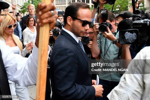 Foreign policy advisor to US President Donald Trump's election campaign, George Papadopoulos and his wife Simona Mangiante Papadopoulos leave the US...