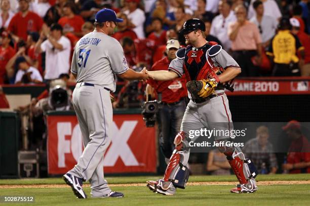 National League All-Star Jonathan Broxton of the Los Angeles Dodgers and National League All-Star Brian McCann of the Atlanta Braves celebrate after...