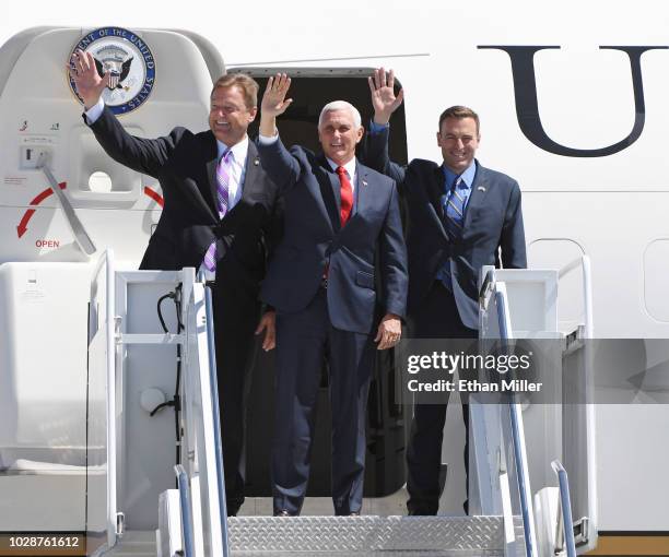 Sen. Dean Heller , U.S. Vice President Mike Pence and Nevada Attorney General and Republican gubernatorial candidate Adam Laxalt wave as they step...