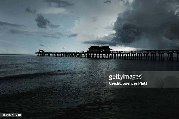 The Naples Pier stands in the evening light on September 7, 2018 in Naples, Florida. Despite being largely clear of the red tide that has plagued the...