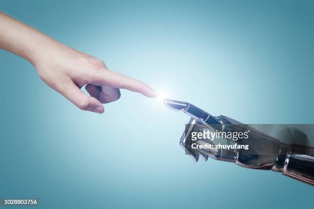 intelligenza artificiale - dito umano foto e immagini stock