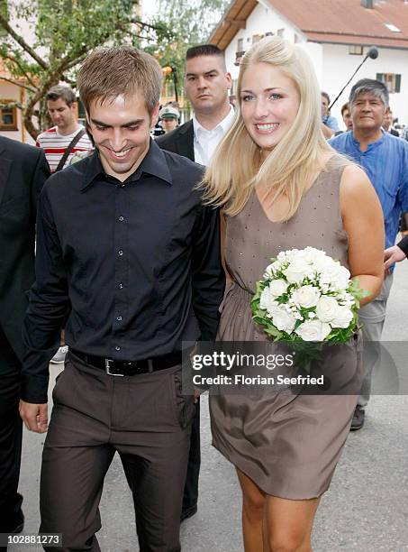Bayern Muenchen football player Philipp Lahm and his new wife Claudia Schattenberg leave their civil wedding at the city hall of Aying on July 14,...