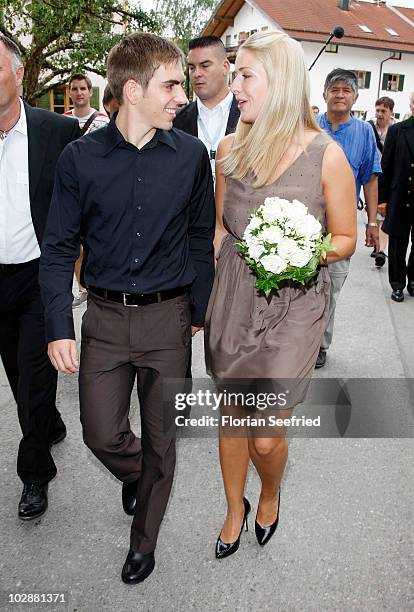 Bayern Muenchen football player Philipp Lahm and his new wife Claudia Schattenberg leave their civil wedding at the city hall of Aying on July 14,...