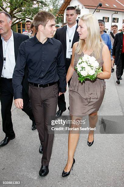 Bayern Muenchen football player Philipp Lahm and his new wife Claudia Schattenberg leave their civil wedding at the city hall of Aying on July 14,...