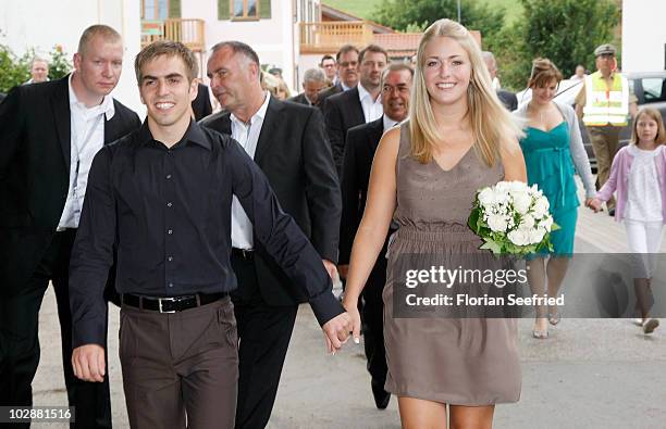 Bayern Muenchen football player Philipp Lahm and Claudia Schattenberg arrive for their civil wedding at the city hall of Aying on July 14, 2010 in...