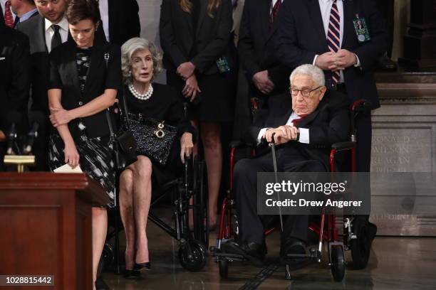 Former US Secretary of state Henry Kissinger and his wife Nancy Kissinger await the arrival of the casket of the late US Senator John McCain inside...