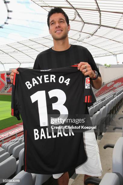 Michael Ballack presents his jersey after the press conference of Bayer Leverkusen at the BayArena on July 14, 2010 in Leverkusen, Germany.