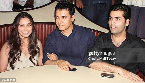 Rani Mukherjee, Aamir Khan and Karan Johar during the music launch of Aamir Khan's forthcoming movie "Peepli Live" in Mumbai on July 13, 2010.
