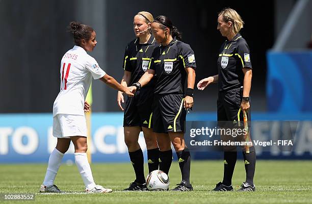 Demi Stokes of England speaks to the referee Helen Karo, Jenny Palmqvist and Anna Nystrom after the FIFA U20 Women's World Cup Group C match between...