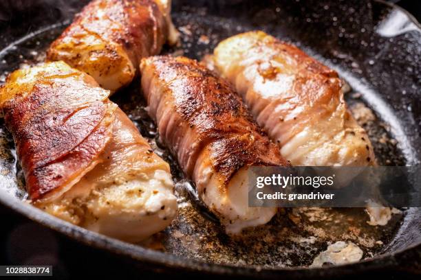 prosciutto di parma ham wrapped cod filets with capers - cod stock pictures, royalty-free photos & images