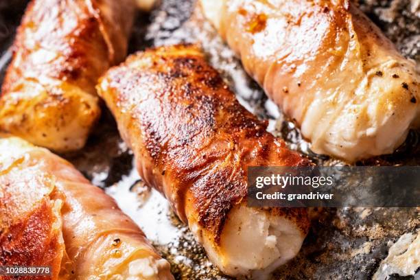 prosciutto di parma ham wrapped cod filets with capers - prosciutto wrapped stock pictures, royalty-free photos & images