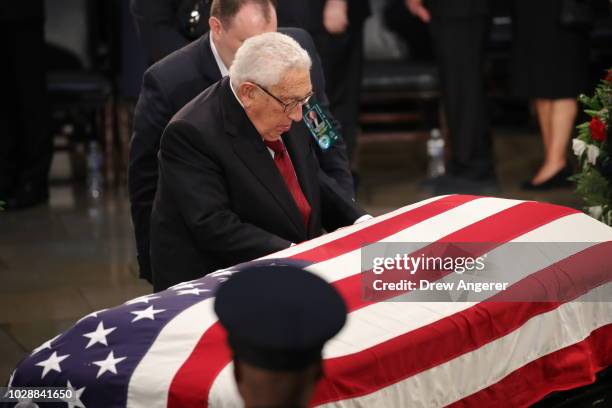 Former US Secretary of state Henry Kissinger honors the late US Senator John McCain inside the Rotunda of the U.S. Capitol, August 31, 2018 in...