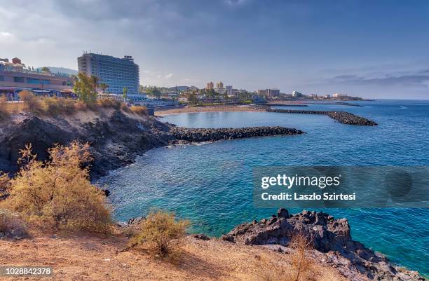 Bay in front of Playa de El Bobo beach is seen at Playa de las Americas on August 23, 2018 in Tenerife, Spain. Playa de las Americas is one of the...