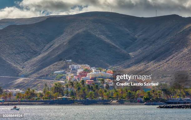 Colorful houses are seen at the harbour of San Sebastián de la Gomera on August 18, 2018 in La Gomera, Spain. From this harbour operate speedboats to...