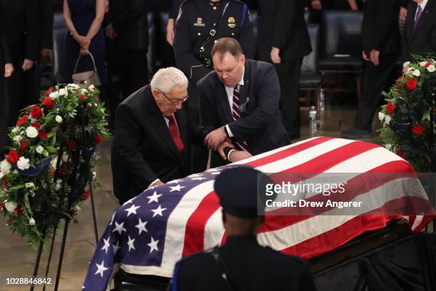 Former US Secretary of state Henry Kissinger honors the late US Senator John McCain inside the Rotunda of the U.S. Capitol, August 31, 2018 in...