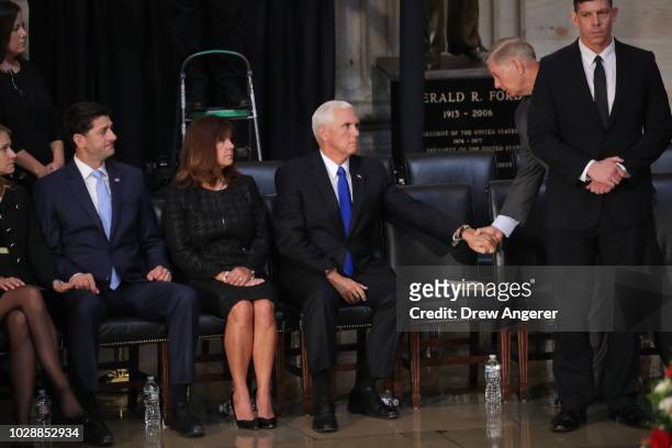 Sen. Lindsey Graham shakes hands with U.S. Vice President Mike Pence as his wife his wife Karen Pence and Speaker of the House Paul Ryan look on...