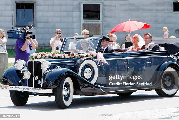 Claudia Schattenberg arrives for her church wedding with FC Bayern Muenchen football player Philipp Lahm together with her sister Melanie...