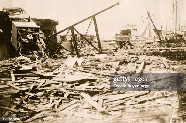 View showing the timbers and overtunred structures strewn about the streets as evidence of the massive destruction left behind by the 'Galveston'...