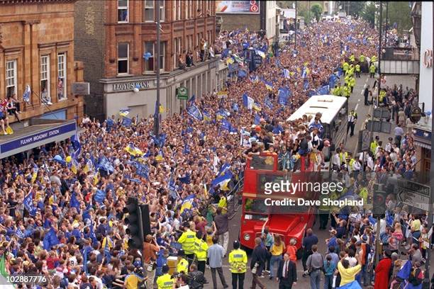 Chelsea players and fans celebrate victory during an open top bus parade celebrating the club winning the 1997 FA Cup Final between Chelsea and...