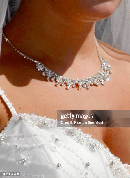 The decolletage and the jewellery of Claudia Schattenberg is pictured after her church wedding with FC Bayern Football Player Philipp Lahm at the...
