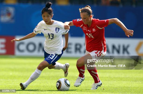 Lia Waelti of Switzerland and Min A Lee of South Korea battle for the ball during the 2010 FIFA Women's World Cup Group D match between Switzerland...