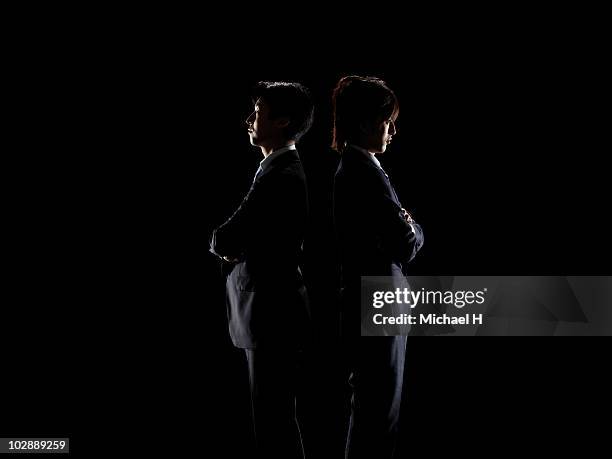 two businessmen who turned its back - confrontation foto e immagini stock