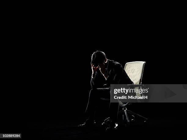businessman who sits on chair and worries - michael sit stock pictures, royalty-free photos & images