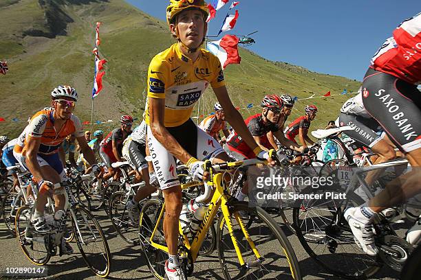 Andy Schleck of team Saxo Bank wears the yellow jersey while riding the 179km Stage 10 of the Tour de France on July 14, 2010 in Gap, France. The...